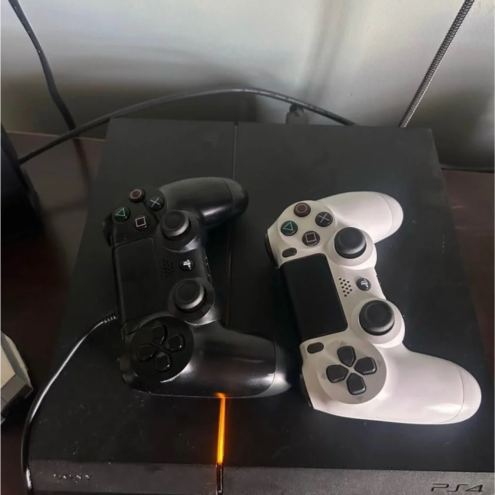 PlayStation 4 with two controllers